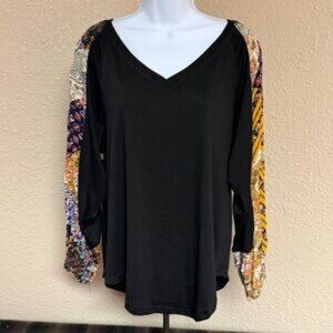 Boho black top with colorful patchwork sleeves. NWT.